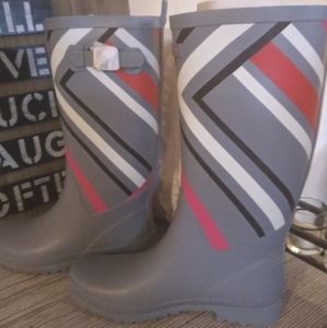 Firm. Brand new Vera Bradley rain boots